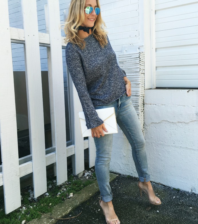 woman wearing Theory Sweater and jeans from june style board