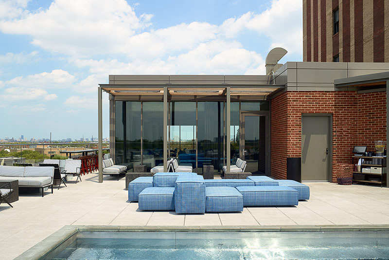 poolside of a hotel with chairs and tables for Outdoors Essentials