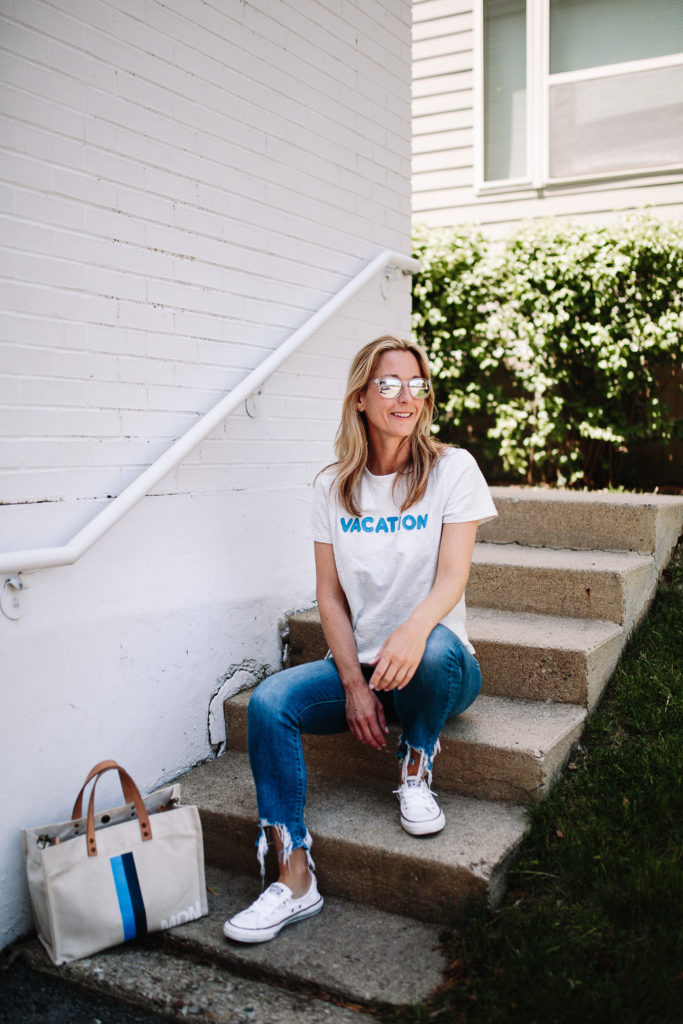 woman spending Summer in Chicago and sitting on stairs