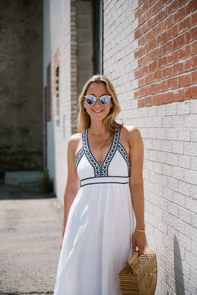 woman in one of the white summer dresses and sunglasses