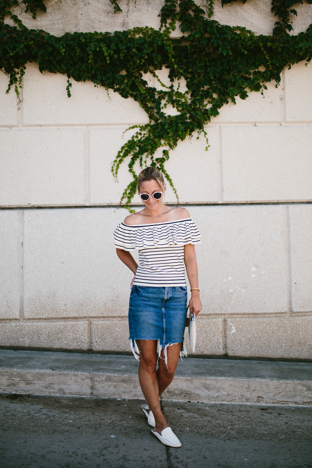 woman wearing denim skirt and striped top 