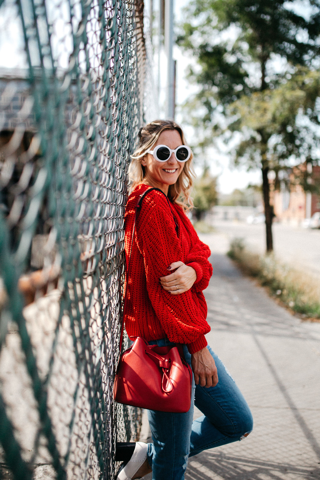 white shades and a red sweater with white rimmed glasses, 5 Sweaters Needed For Fall