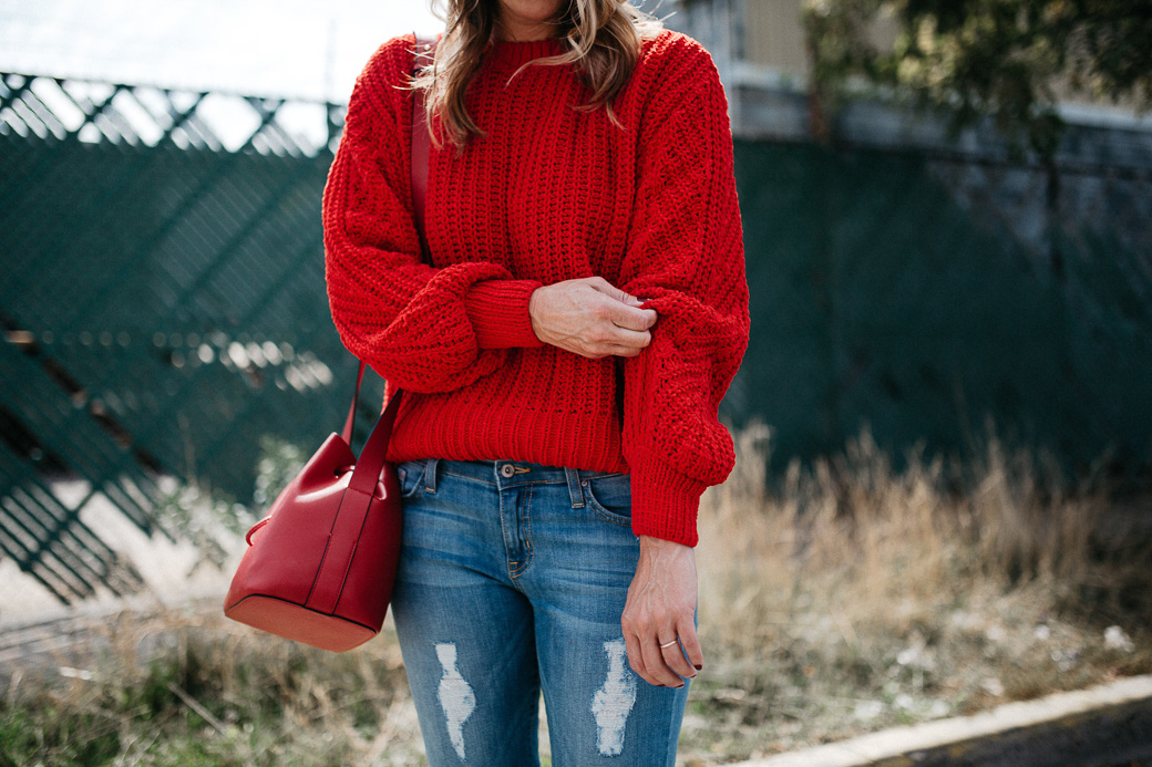 5 Sweaters Needed For Fall include this red sweater that is plush and large to keep you extra warm this fall