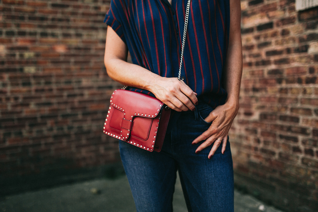 red purse with navy striped top