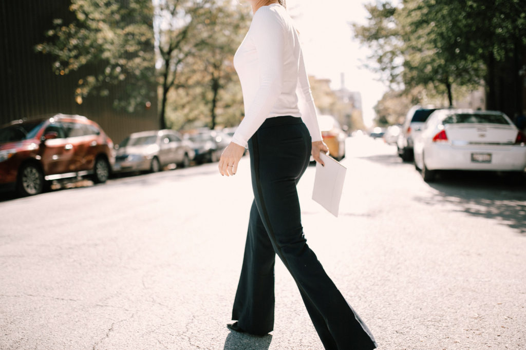 Navy athleisure pants with white fitted top