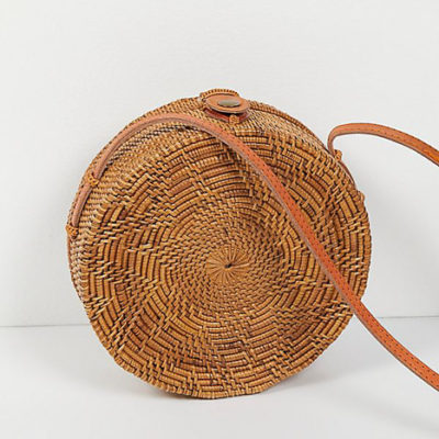 A round straw crossbody bag for five spring break favorites