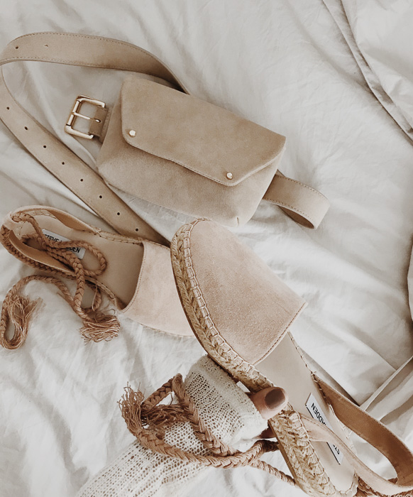 Detailed shot of neutral blush belt bag and espadrilles