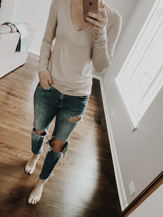 woman wearing A neutral basic long sleeve tee in blush tone is perfect for spring 