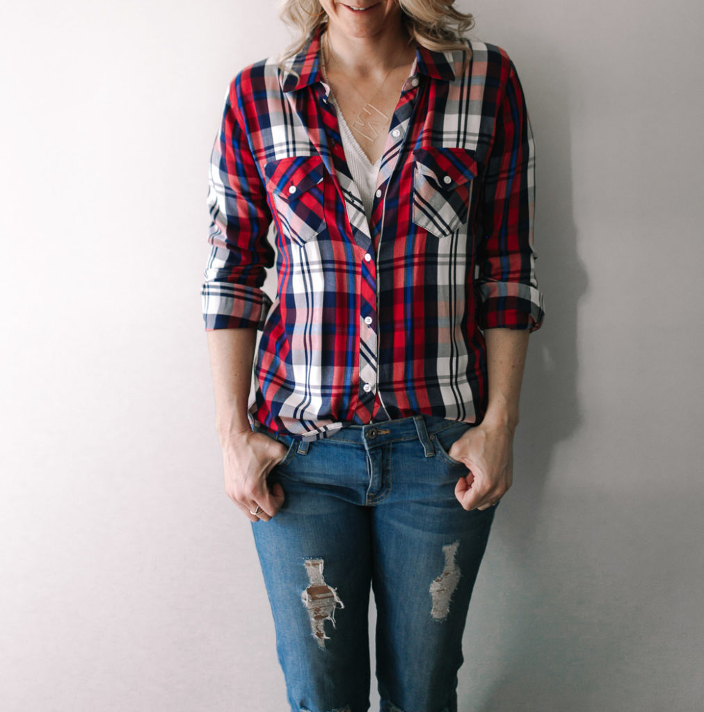 woman Wearing a stripe button down for spring transitional clothing 