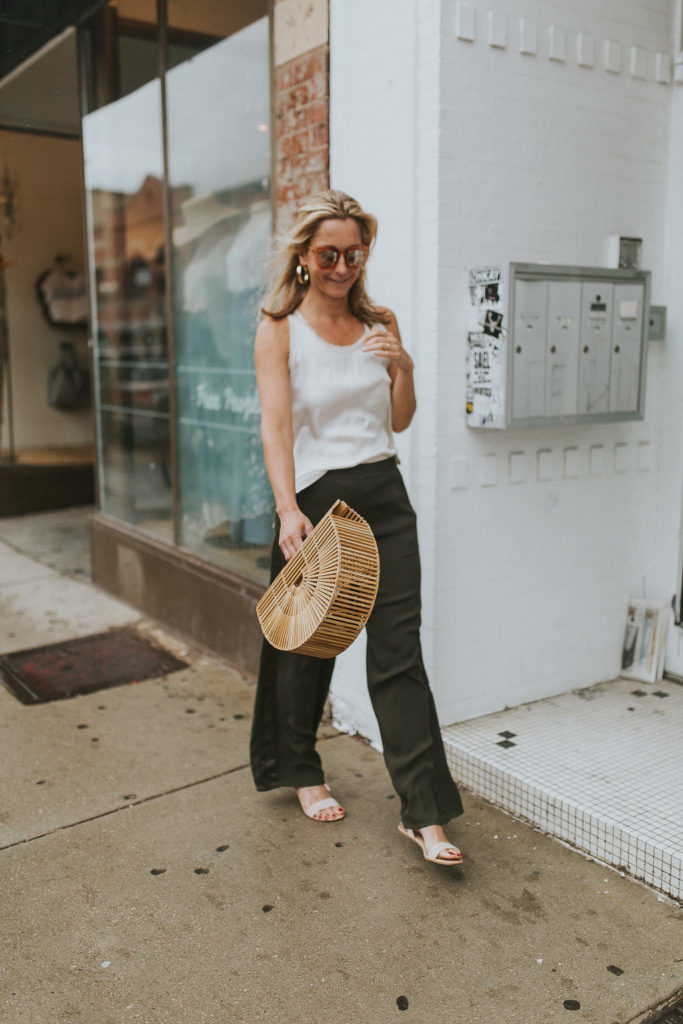 Megan is walking with a Cult Gaia bag - Never Without Navy