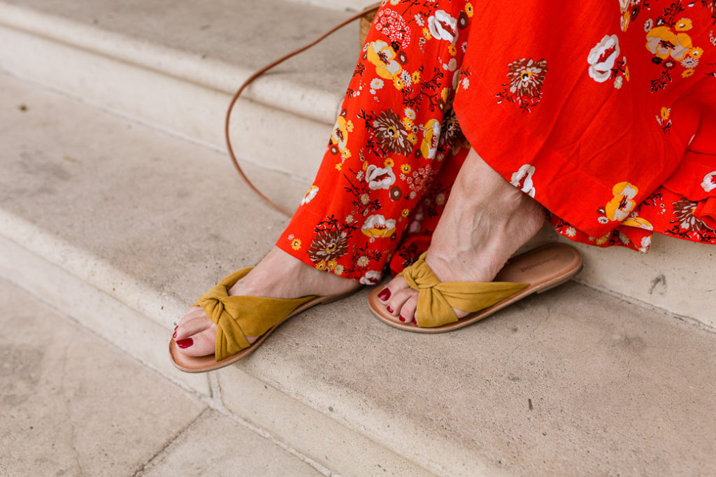 Pair a red floral maxi dress with marigold flats