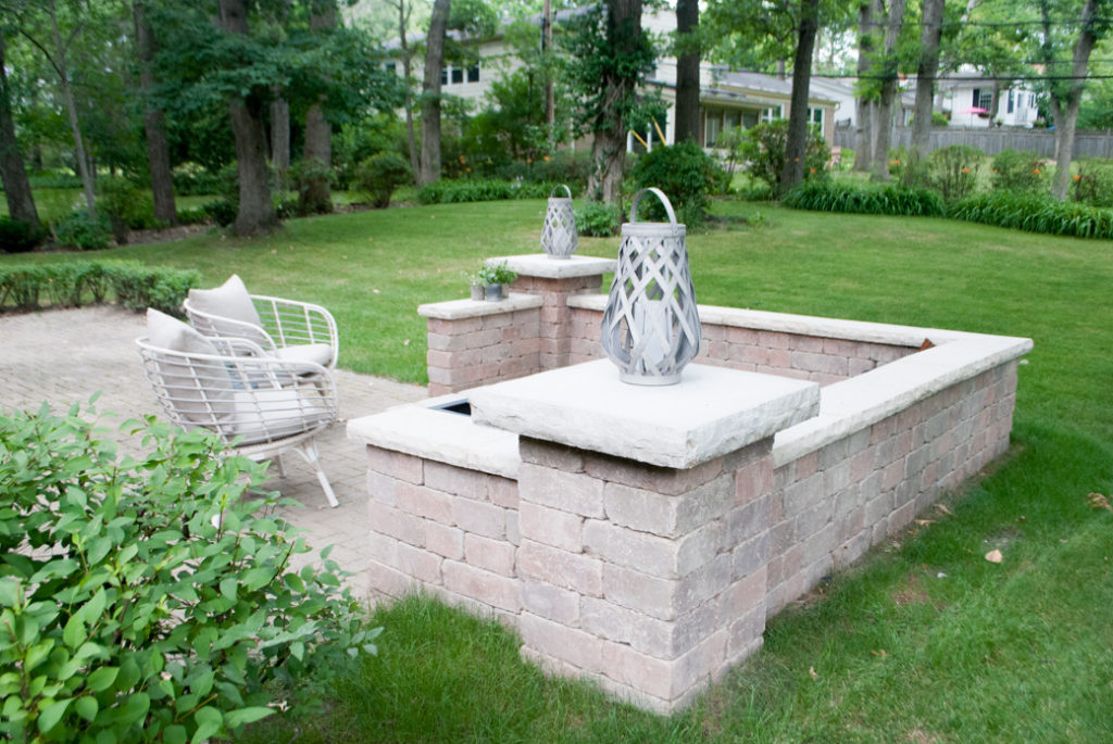 How to build an outdoor patio space with bricks and a fireplace