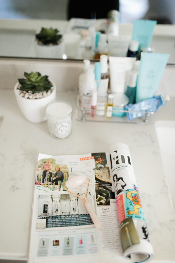 Rose Quartz Roller displayed on bathroom vanity