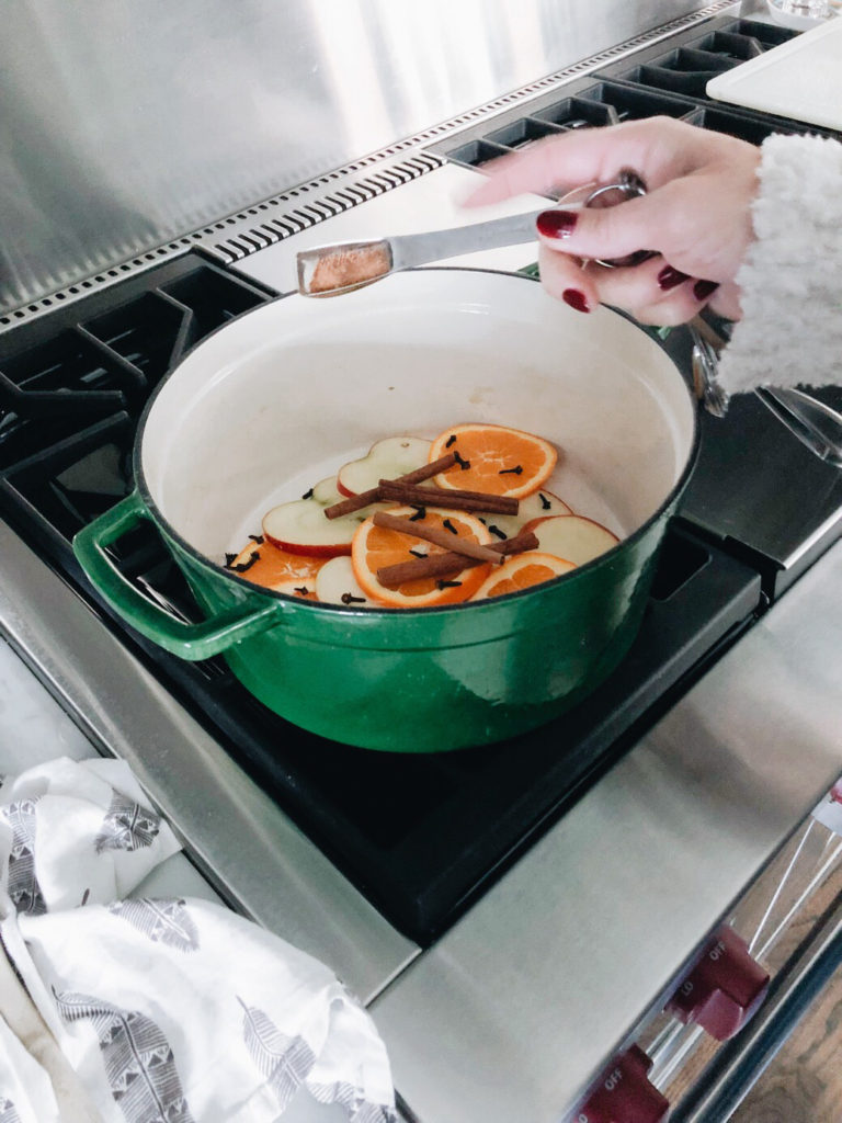 Stovetop potpourri adding nutmeg and vanilla