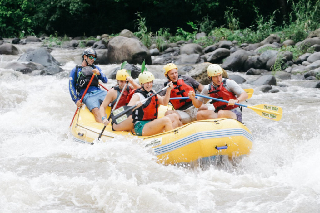 people doing white water rafting 