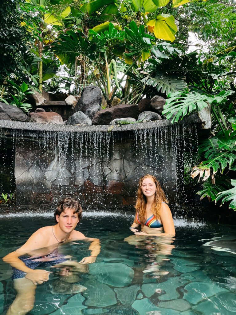 two people swimming in a pool in Costa Rica